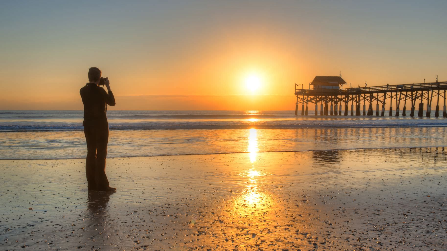 photographer shooting a sunset image 