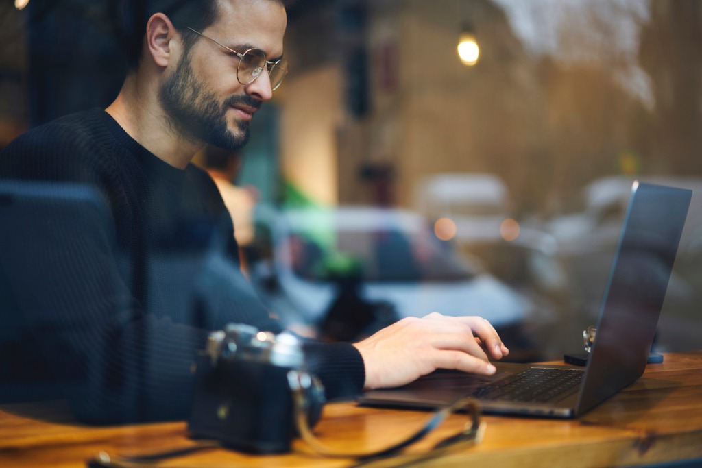 bearded entrepreneur male in glasses dressed in black sweater reading picture id905148386 image 