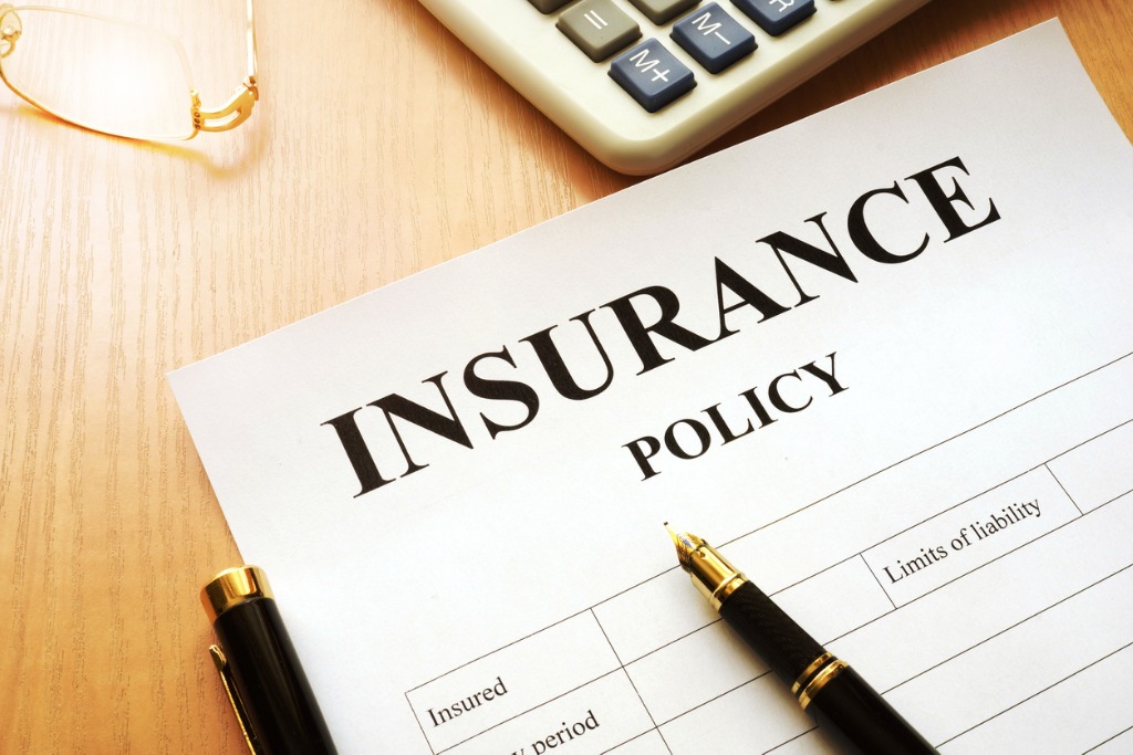 insurance policy on a desk picture id841218106