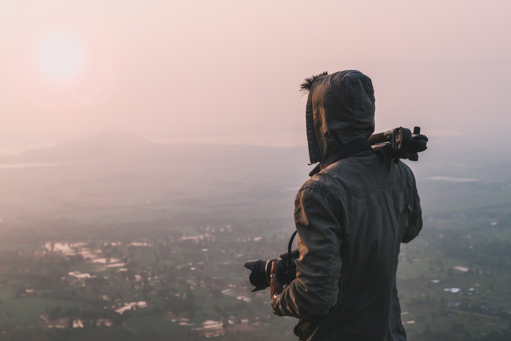 man traveler photographer and camera taking photo on mountains in the picture id928307128 image 