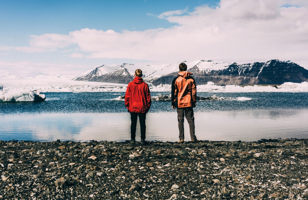 two men standing near the lake with glaciers picture id531068248 image 