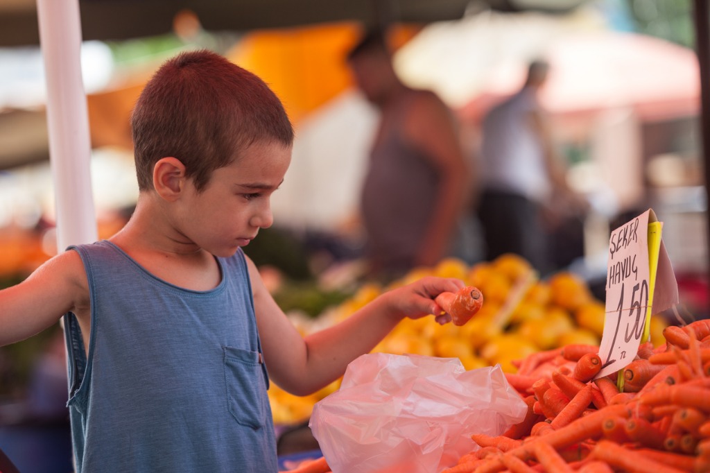 little boy shopping in street farmers market picture id879005578 image 