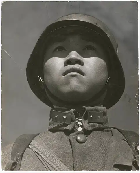This picture was captured by Robert Capa and one of his brilliant work him. The picture represents a Chinese soldier. image 