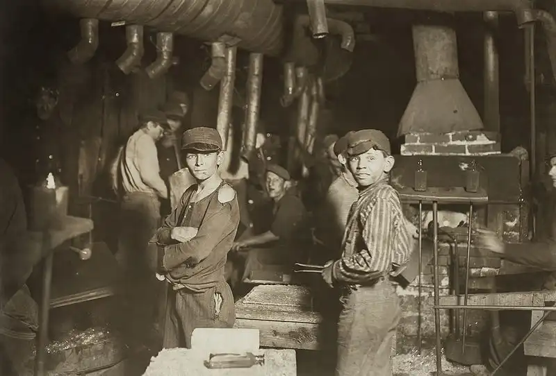 This picture displaying two boys and other workers was captured by Lewis Hine. This is the major work of Lewis Hine. image 