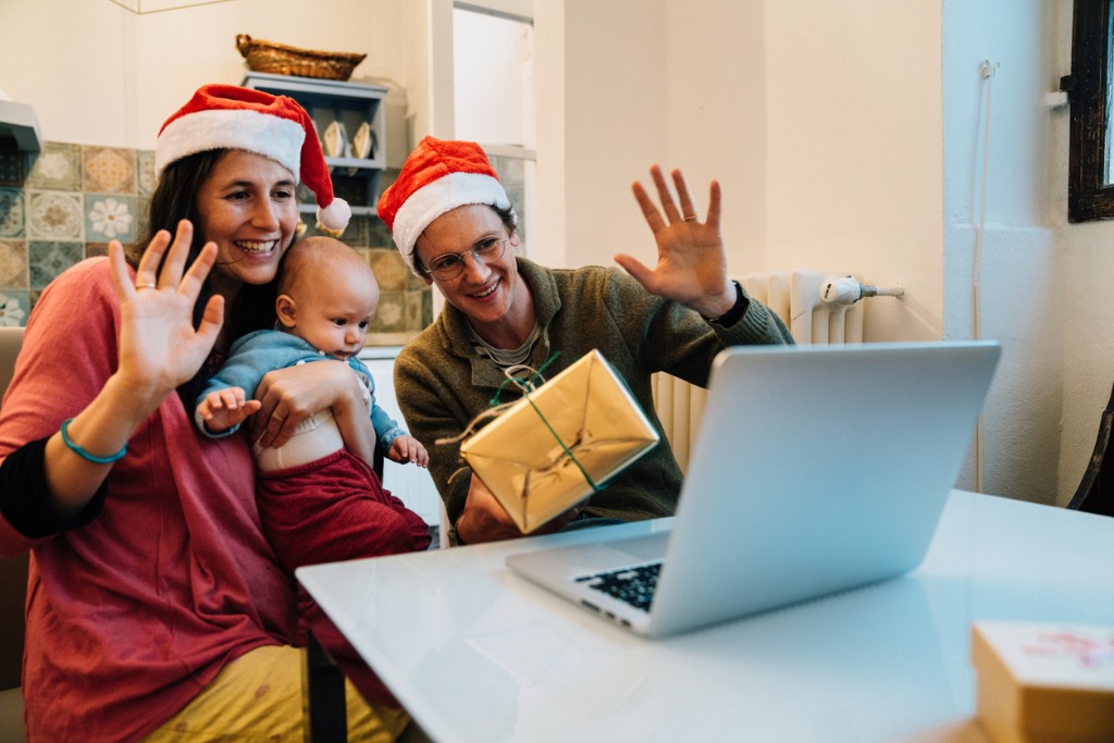 family celebrating christmas together with a video call picture id1282457225 image 