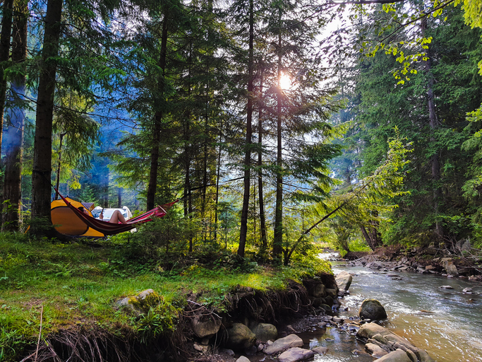 Camping next to a river image 