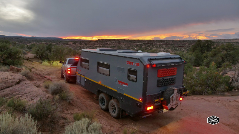Conqueror Off Road Campers UEV 19 driving at sunset image 