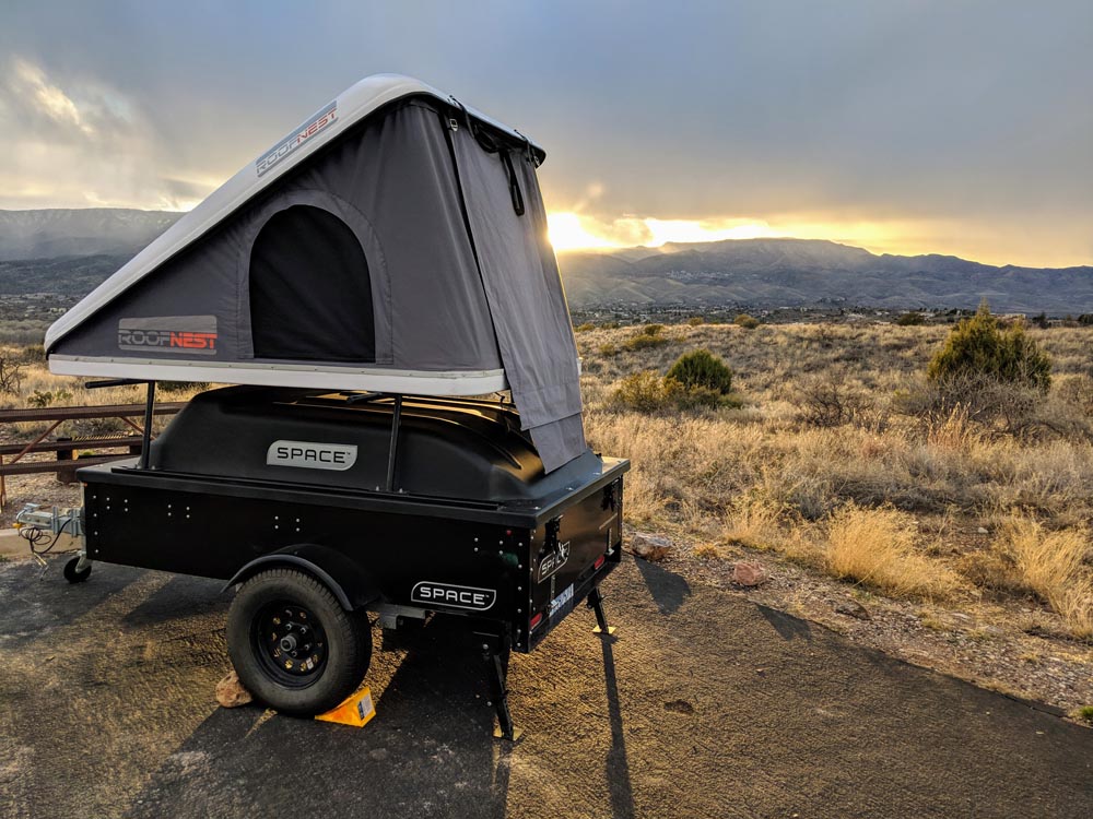 space trailer with rooftop tent at sunset image 